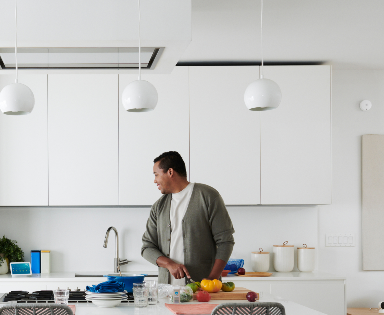 Man in kitchen using the ADT command panel