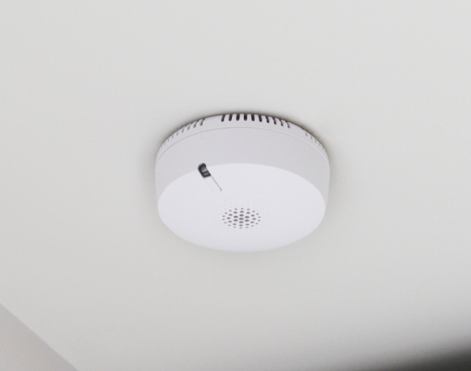 ADT smoke detector on a ceiling in a home